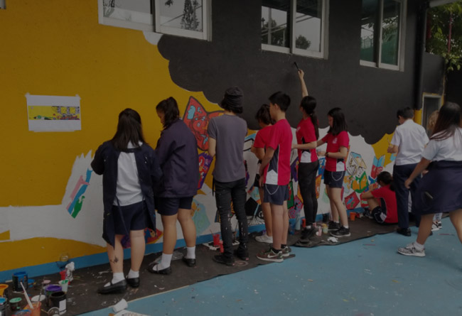 Middle School students painting mural